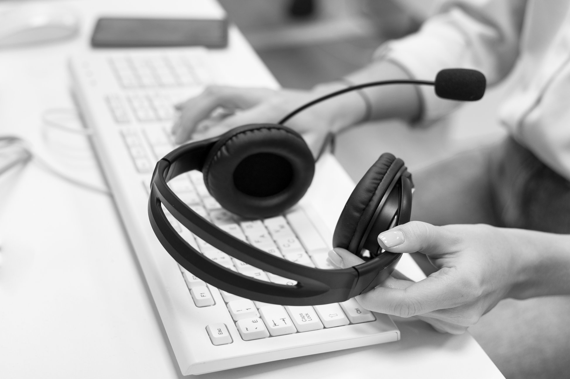 contact-us-woman-holding-pair-headphones contact-us-woman-holding-pair-headphones